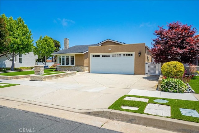 20002 Tomlee Ave, Torrance, CA 90503 - single story home with a garage, stucco siding, stone siding, a chimney, and concrete driveway