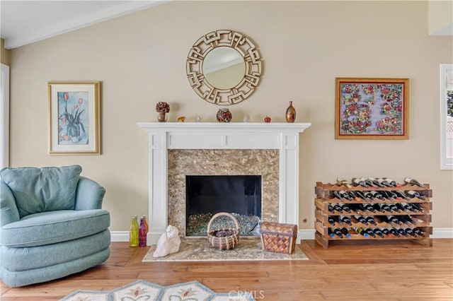 20002 Tomlee Ave, Torrance, CA 90503 - living area featuring wood finished floors, a high end fireplace, and vaulted ceiling