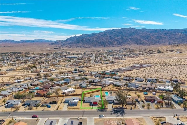 73461 El Paseo Dr Unit 29, Palms, CA 92277 - aerial view of residential area featuring a mountainous background and property parcel outlined