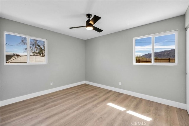 73461 El Paseo Dr Unit 29, Palms, CA 92277 - unfurnished room featuring healthy amount of natural light, wood finished floors, and a ceiling fan