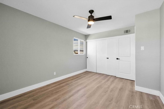 73461 El Paseo Dr Unit 29, Palms, CA 92277 - unfurnished bedroom featuring wood finished floors, a closet, and a ceiling fan