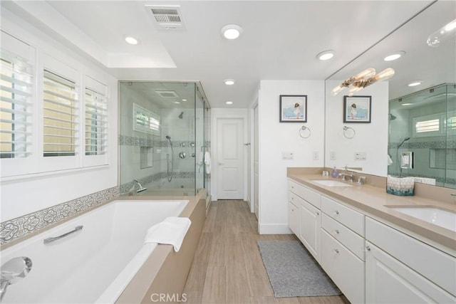 3312 W Oceanfront, Newport Beach, CA 92663 - bathroom featuring a shower stall, a bath, double vanity, plenty of natural light, and recessed lighting