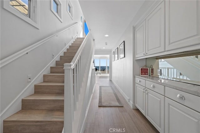 3312 W Oceanfront, Newport Beach, CA 92663 - stairway featuring wood finished floors and recessed lighting