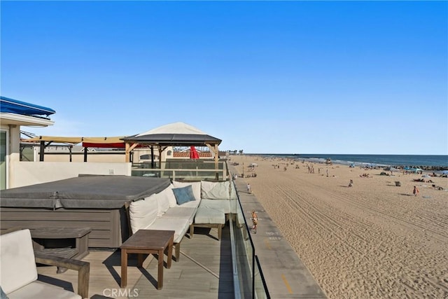 3312 W Oceanfront, Newport Beach, CA 92663 - exterior space with a jacuzzi, a gazebo, and view of water and beach
