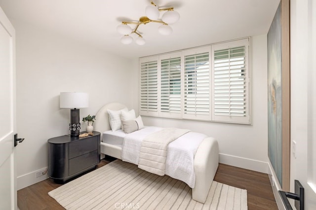 1933 Port Bristol Cir, Newport Beach, CA 92660 - bedroom with a chandelier and wood finished floors