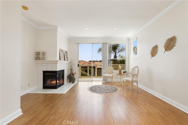 30902 Clubhouse Dr Unit 17A, Laguna Niguel, CA 92677 - living area featuring a fireplace, wood finished floors, and ornamental molding