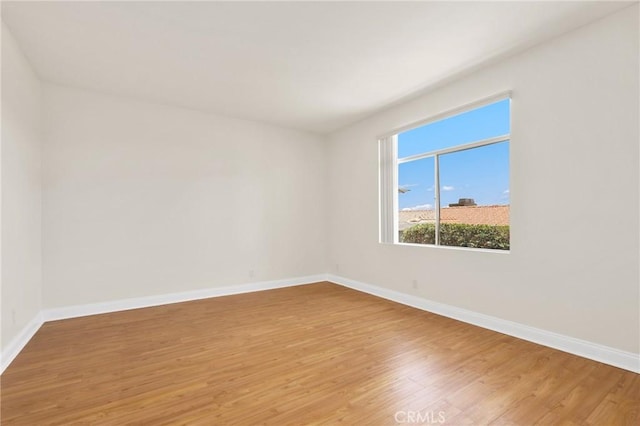 30902 Clubhouse Dr Unit 17A, Laguna Niguel, CA 92677 - spare room featuring baseboards and light wood finished floors