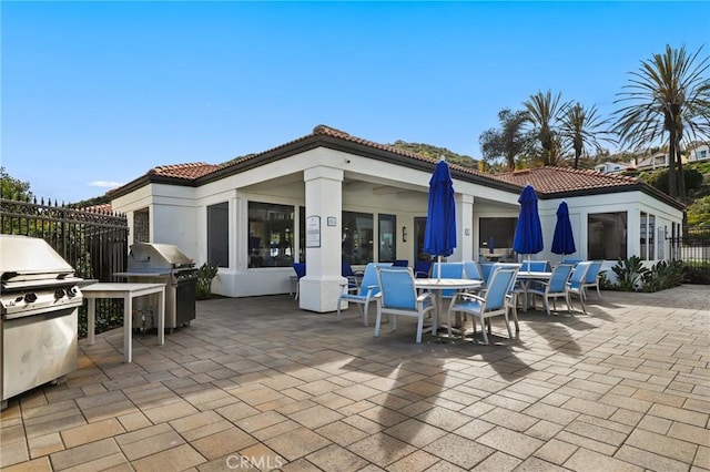 30902 Clubhouse Dr Unit 17A, Laguna Niguel, CA 92677 - view of patio / terrace featuring an outdoor kitchen and outdoor dining area