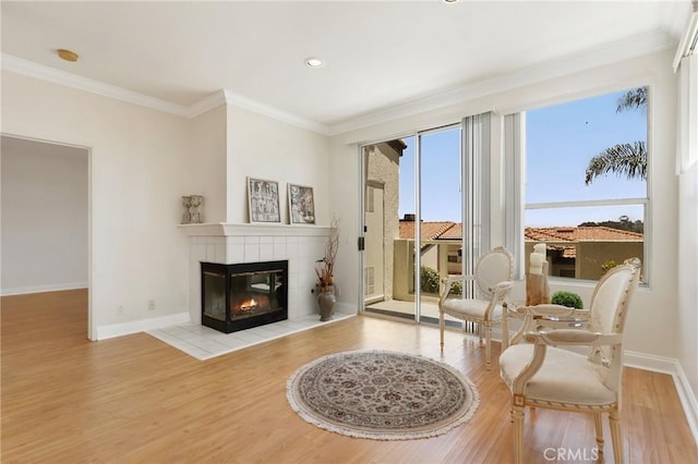 30902 Clubhouse Dr Unit 17A, Laguna Niguel, CA 92677 - living room featuring wood finished floors, crown molding, a fireplace, and recessed lighting