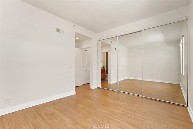 30902 Clubhouse Dr Unit 17A, Laguna Niguel, CA 92677 - unfurnished bedroom featuring light wood finished floors