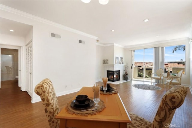 30902 Clubhouse Dr Unit 17A, Laguna Niguel, CA 92677 - living area with wood finished floors, crown molding, a fireplace with flush hearth, and recessed lighting