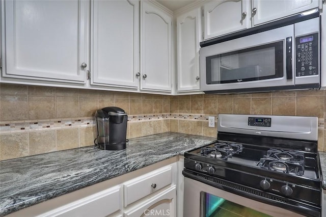 8366 Gabriel Dr Unit D, Rancho Cucamonga, CA 91730 - kitchen featuring stainless steel appliances, white cabinetry, dark stone counters, and tasteful backsplash