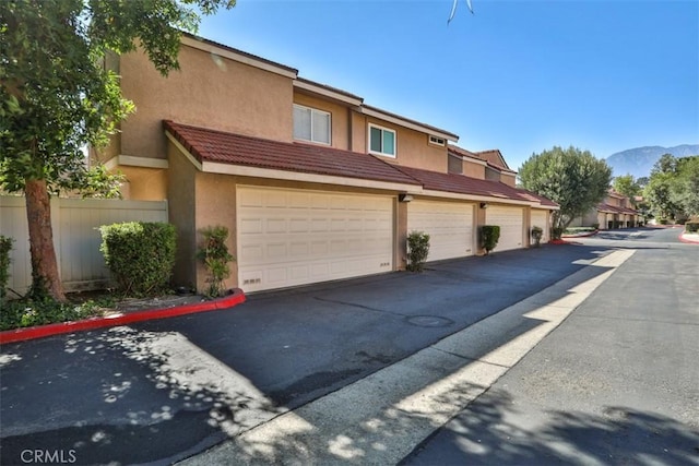 8366 Gabriel Dr Unit D, Rancho Cucamonga, CA 91730 - view of front of house with stucco siding and a mountain view