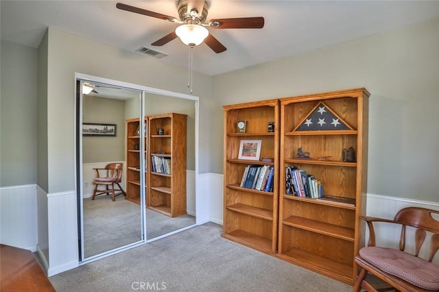8366 Gabriel Dr Unit D, Rancho Cucamonga, CA 91730 - living area with a wainscoted wall, ceiling fan, and carpet flooring