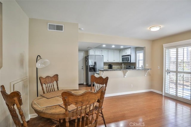 8366 Gabriel Dr Unit D, Rancho Cucamonga, CA 91730 - dining area featuring light wood-style flooring