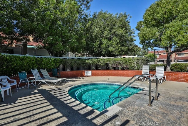 8366 Gabriel Dr Unit D, Rancho Cucamonga, CA 91730 - view of pool featuring a community hot tub, a swimming pool, and a patio area