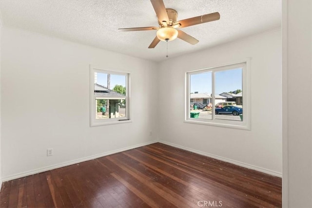 1550 Kaufman Ave, Corning, CA 96021 - spare room with dark wood finished floors, a textured ceiling, and a ceiling fan