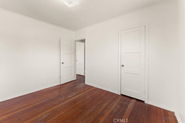 1550 Kaufman Ave, Corning, CA 96021 - empty room featuring dark wood-style floors, ornamental molding, and a textured ceiling