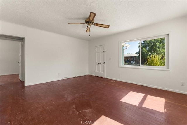 1550 Kaufman Ave, Corning, CA 96021 - spare room featuring wood-type flooring, ceiling fan, and a textured ceiling
