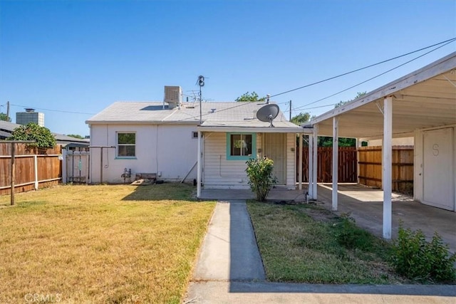 1550 Kaufman Ave, Corning, CA 96021 - back of property featuring a fenced backyard and a carport