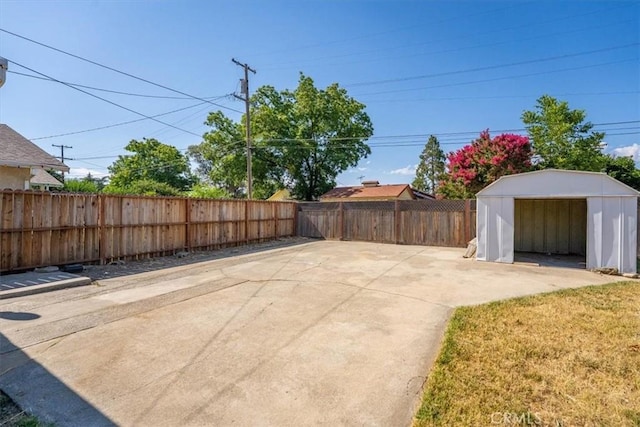 1550 Kaufman Ave, Corning, CA 96021 - fenced backyard featuring a storage shed and a patio