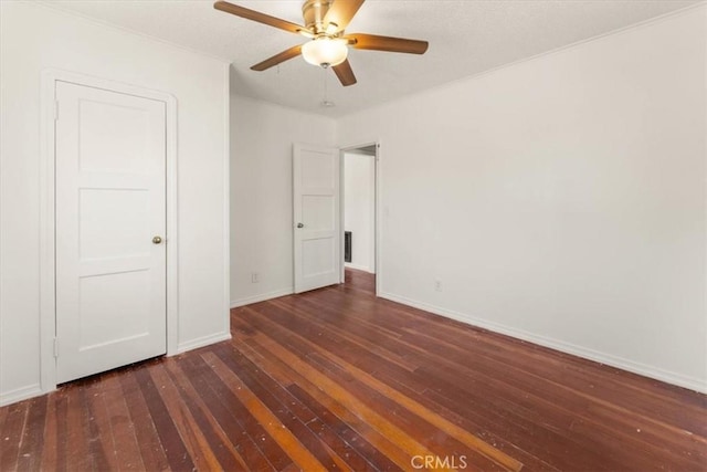 1550 Kaufman Ave, Corning, CA 96021 - unfurnished bedroom with dark wood-style floors and ceiling fan