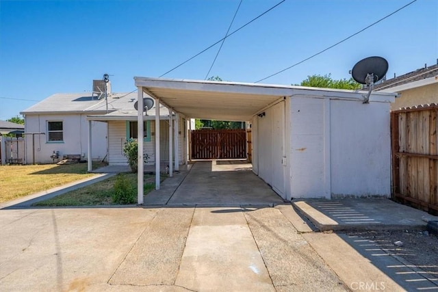 1550 Kaufman Ave, Corning, CA 96021 - view of parking / parking lot with concrete driveway and a carport