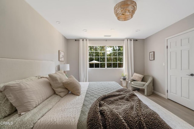 5907 Cantaloupe Ave, Valley Glen, CA 91401 - bedroom featuring wood finished floors and baseboards