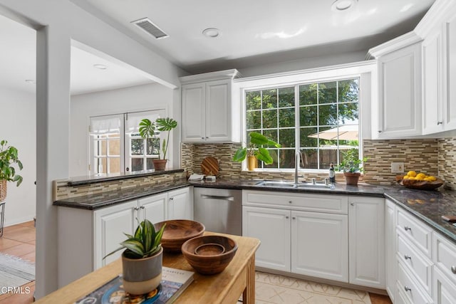 5907 Cantaloupe Ave, Valley Glen, CA 91401 - kitchen featuring dishwasher, decorative backsplash, white cabinetry, and recessed lighting