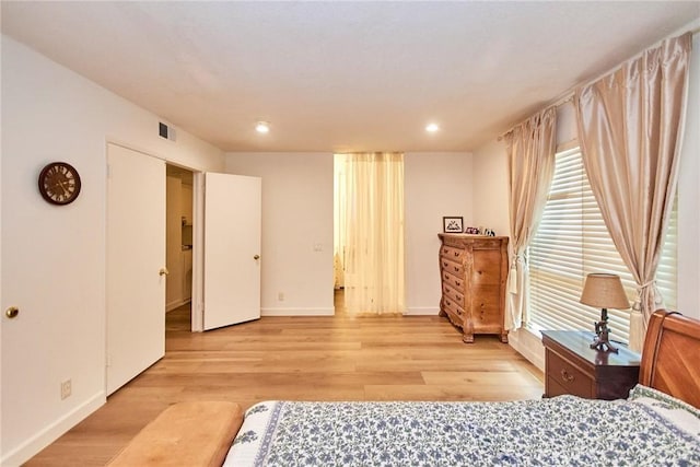5574 Elsinore Ave, Buena Park, CA 90621 - bedroom with light wood-style floors and recessed lighting