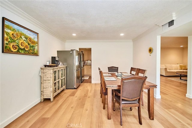 5574 Elsinore Ave, Buena Park, CA 90621 - dining area with light wood-type flooring, ornamental molding, recessed lighting, and a textured ceiling
