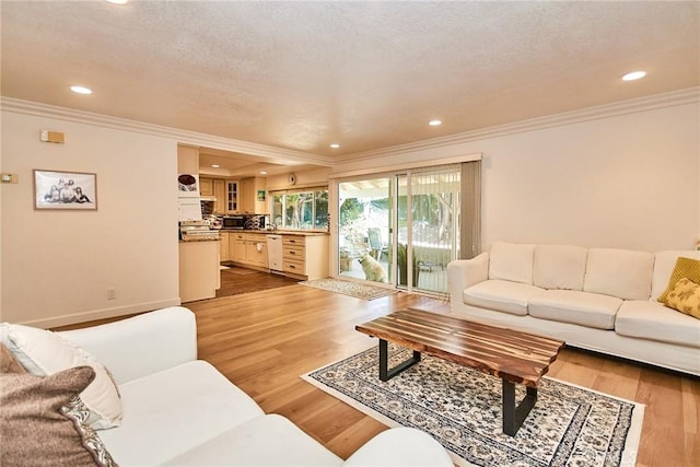 5574 Elsinore Ave, Buena Park, CA 90621 - living room featuring crown molding, light wood-type flooring, and recessed lighting