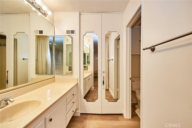 5574 Elsinore Ave, Buena Park, CA 90621 - full bath featuring vanity and wood finished floors