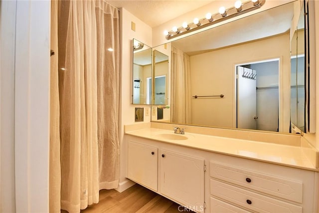 5574 Elsinore Ave, Buena Park, CA 90621 - bathroom featuring vanity and wood finished floors