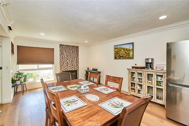 5574 Elsinore Ave, Buena Park, CA 90621 - dining area with a textured ceiling, ornamental molding, light wood-style floors, and recessed lighting