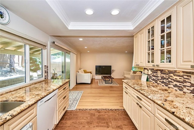 5574 Elsinore Ave, Buena Park, CA 90621 - kitchen featuring dishwasher, cream cabinetry, open floor plan, tasteful backsplash, and light wood finished floors
