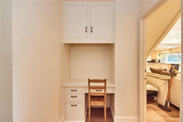 5574 Elsinore Ave, Buena Park, CA 90621 - office area featuring light wood-style floors and built in desk
