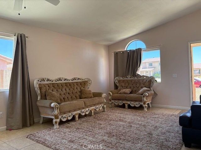 10810 Euclid St, Adelanto, CA 92301 - tiled living room featuring ceiling fan and baseboards