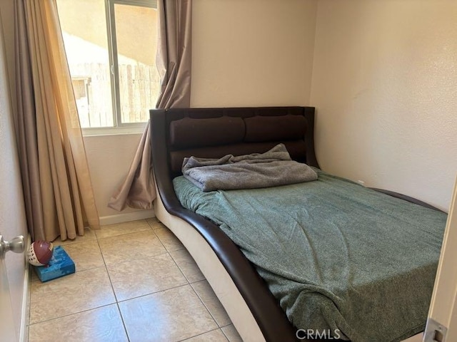 10810 Euclid St, Adelanto, CA 92301 - bedroom featuring light tile patterned floors