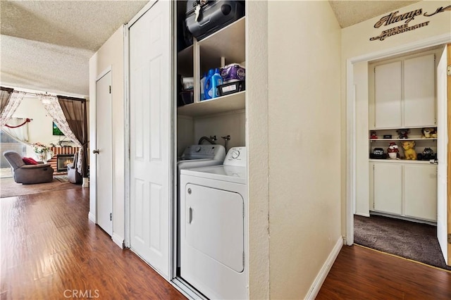 37158 29th St E, Palmdale, CA 93550 - washroom with a textured ceiling, dark wood-style floors, and independent washer and dryer