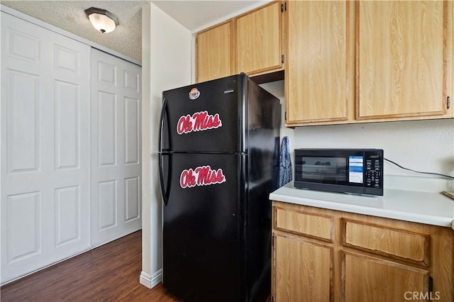 37158 29th St E, Palmdale, CA 93550 - kitchen with black appliances, dark wood finished floors, light countertops, and a textured ceiling