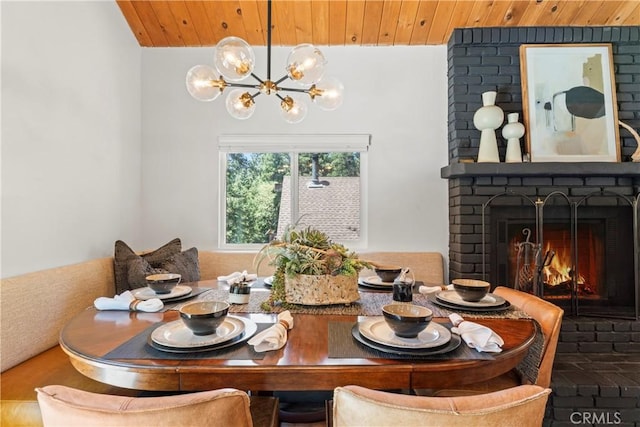 1016 Berne Dr, Crestline, CA 92325 - dining room with a chandelier, a brick fireplace, and wood ceiling