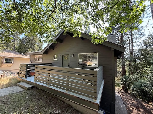 1016 Berne Dr, Crestline, CA 92325 - bungalow-style house with a chimney and a deck