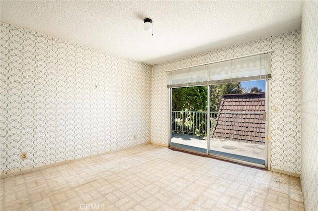 448 Via El Chico, Redondo Beach, CA 90277 - empty room with wallpapered walls and a textured ceiling