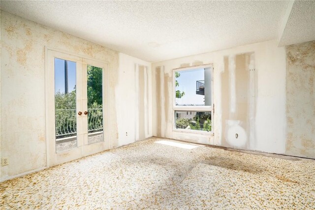 448 Via El Chico, Redondo Beach, CA 90277 - unfurnished room with french doors and a textured ceiling