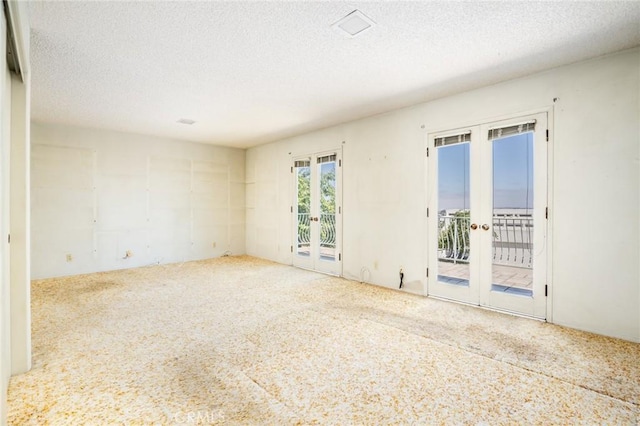 448 Via El Chico, Redondo Beach, CA 90277 - unfurnished room featuring french doors, carpet floors, and a textured ceiling