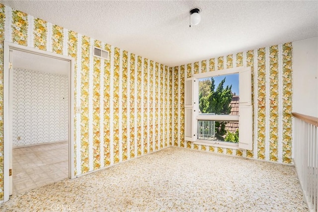 448 Via El Chico, Redondo Beach, CA 90277 - spare room featuring wallpapered walls and a textured ceiling