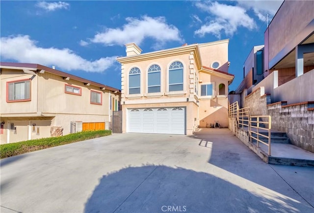1742 Hanscom Dr, South Pasadena, CA 91030 - view of front of house with driveway, a chimney, a garage, and stucco siding