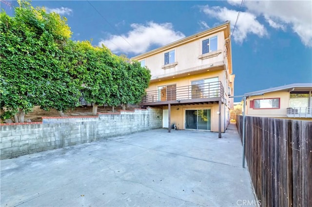 1742 Hanscom Dr, South Pasadena, CA 91030 - rear view of property featuring stucco siding, a patio, and a balcony