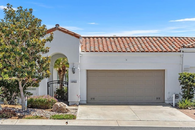 4763 Miletus Way, Oceanside, CA 92056 - mediterranean / spanish house featuring a tiled roof, stucco siding, and concrete driveway
